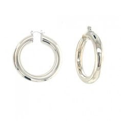 Crafted with meticulous attention to detail, these hoops showcase a generous size and a chunky design that commands attention. Embrace the bold and striking allure of the large chunky silver-plated hoops, adding a touch of modern elegance and self-assured style to your accessory collection. Hoop Size: 7.5mm x 45mm Modern Chunky Metal Earrings, Chic Silver Hoop Earrings With Polished Finish, Silver Chunky Classic Jewelry, Chic Polished Silver Hoop Earrings, Classic Silver Chunky Jewelry, Modern Chunky Silver Jewelry, Classic Chunky Silver Jewelry, Chunky Metal Hoop Earrings Modern Style, Modern Chunky Metal Hoop Earrings