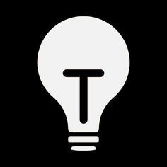 a light bulb with the letter t in it's center on a black background