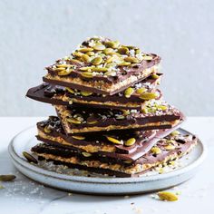 a stack of chocolate and pistachio bars on a plate