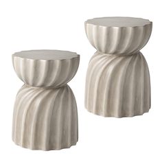 two white vases sitting next to each other