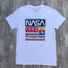 Nasa United States Shirt Shipping from the US. Easy 30 day return policy, 100% cotton, Double-needle neck, sleeves and hem; Roomy Unisex Fit. Casual Streetwear Shirt With Front Print, Fitted Graphic Tee Shirt With Front Print, Trendy Cotton Shirt With Front Print, Graphic Tee Shirt With Logo Print For Spring, Casual Fitted Shirt With Screen Print, Casual Cotton Shirt With Letter Print, Fitted Casual Shirt With Screen Print, Casual Cotton Shirt With Front Print, Sporty Shirt With Text Print For Spring