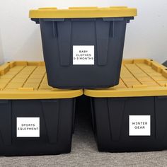 three plastic storage containers with labels on them