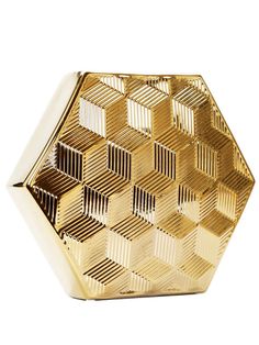 a gold plated vase with geometric designs