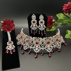 Indian, Pakistani jewelry. Premium quality American diamond necklace set with maang tikka, perfect for all occasions. Traditional Diamond Necklace For Party, Traditional Party Diamond Necklace, Bollywood Style Diamond Jewelry Sets For Gifts, Bollywood Diamond Jewelry Sets For Reception, Traditional Handcrafted Diamond Sets, Elegant Festive Tikka With Cubic Zirconia, Elegant Festive Cubic Zirconia Tikka, Traditional Jewelry Sets With Diamond Accents For Festive Occasions, Traditional Festive Jewelry Sets With Diamond Accents