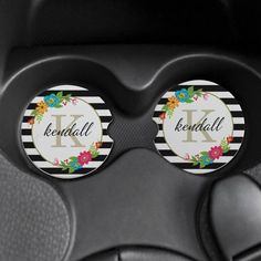 two black and white floral monogrammed car emblems with the letter k on them