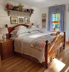 a bed sitting in a bedroom next to a window