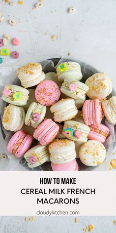 french macarons with pink and yellow sprinkles on them in a bowl