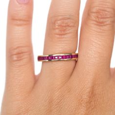 VIEW A VIDEO OF THIS RING ON YOUTUBE https://youtu.be/avE-L9TrtiM Description: This wonderful dainty ruby wedding band is sure to catch anyones eye! The natural rubies are square princess cut, set in 14k yellow gold and weighs 1.00ct. It is an unforgettable piece from the the 1930's in a Retro style you'll adore. This is a true antique piece, and we are honored to offer it to our Etsy family. This ring can be sized up or down 4 sizes for an additional $40. If you wish to have a ring sized please Ruby Wedding Band, Ruby Wedding, Natural Ruby, Princess Cut, Retro Style, Wedding Band, Retro Fashion, Wedding Bands, Ruby