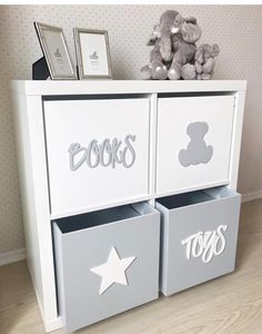 a toy chest with two bins and a teddy bear on top