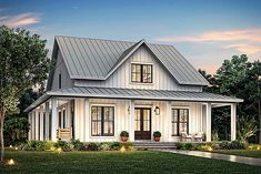 a white house with a metal roof and porch