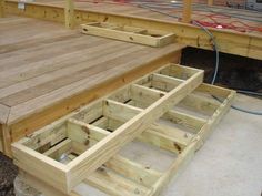 the bottom part of a wooden deck being built