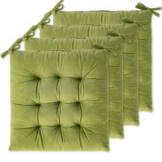 four green cushions with ties on them