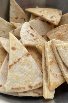 some tortilla chips in a metal bowl