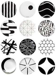 black and white plates with designs on them