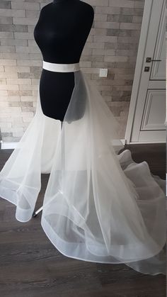 Thick organza detachable open front wedding train - an elegant adding to your wedding gown can be matched with different styles wedding gowns. Also, the skirt can be ordered in full, with Royal satin underneath skirt, Tulle crinoline and Lining. Please select all your preferred options and indicate your size at checkout. Kindly note that this listing is for the skirt presented in the first pictures. In case you are interested to buy one of optional items from the last pictures, please let me kno Train Skirt, Organza Wedding Dress With Detachable Train For Evening, Wedding Gown With Organza Tulle Skirt, Organza Wedding Dress With Detachable Train, Flowy Wedding Gown, Fitted Organza Tulle Fabric For Wedding, Organza Wedding Dress With Flowy Skirt, Floor-length Organza Bridesmaid Dress, Bridal Dresses With Detachable Train In Organza