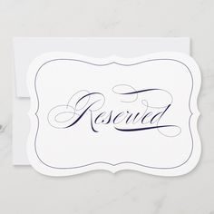 a white card with the word reserved on it