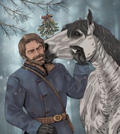 a man standing next to a horse in front of a tree with a christmas ornament on it