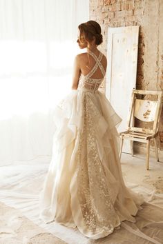 a woman in a wedding dress looking back