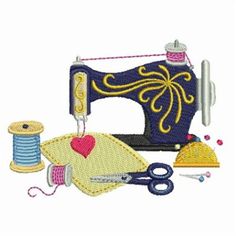 the sewing machine is next to some thread and spools with scissors on it