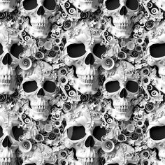 black and white photograph of skulls with swirls