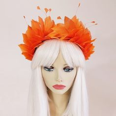 Divalicious Feather Crown 'Bianca' is a divine piece handcrafted with soft gorgeous feathers. Colours: Orange feathers designed on a black satin Alice headband approximately 1.5cm wide. The 'Bianca' Feather Crowns are easy, lightweight and comfortable to wear. Wear her to the races, weddings, festivals and swanky soirées x The 'Bianca' Divalicious Feather Crowns are inspired by style icon Bianca Jagger, the reigning Queen of the Studio 54 scene. Designed with love by Sarah Homburg in the Whitsun Spring Feather Hair Accessories, Spring Fitted Feather Hair Accessories, Summer Festival Headband Costume Hats And Headpieces, Fitted Halloween Headband Headpieces, Fitted Halloween Headband, Summer Festival Costume Headband, Fitted Carnival Headband Headpiece, Fitted Headband For Carnival, Costume Party Headband