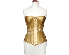 Real Golden Leather With Twill Jeans as Lining Steel Bones Leather Corset Strong Metal Busk Bones Fastening at Front Spiral - Flexible Steel Bones around the corset Rigid Steel Plates at the Back Heavy Duty, Steel Boned Leather Corset Reduce Waist up to 4" It can be used for Tight Lacing, Shaping and waist Training This Fashion Corset is popular uses in Clubbing, As Cosplay, In Wedding on Bride Dress, In Parties and Slim Fitting Pants or Skirts are Beautiful combination with a corset. Available Corset Sizes:- 3XS ~ 7XL (Custom sizing facility available) Available Corset Colors:- Black ~ Brown ~ White ~ Red How to Select Right Size For Example If your natural waist is 30" then you will order "M" size fully Closed 26". Every Corset is 4" Smaller then the Waist. Why Choose Us ? More than 100 Golden Corset, Korsett Top, Leather Cosplay, Fashion Corset, Fitting Pants, Steel Plates, Steampunk Corset, Waist Shapers, Lace Tights