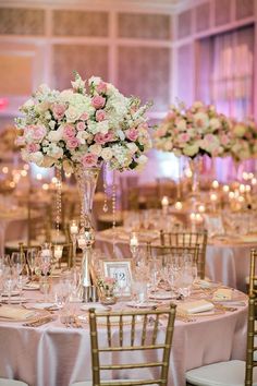 the centerpieces are filled with pink and white flowers