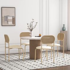 a dining table with four chairs around it