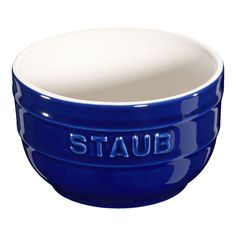 a blue and white bowl with the word staub on it