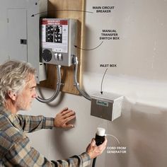 a man is fixing an electrical outlet on the wall