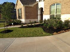 a house with landscaping in front of it