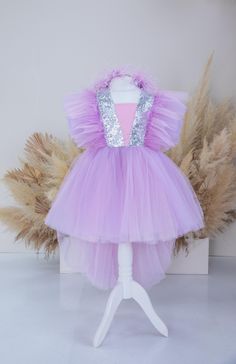 Lavender Tutu Birthday Baby Dress, Feathers Sleeve, Graduation Gown, Flower Girl Photoshoot Dress, Special Occasion, Pageant Toddler Dress Cute girl dress  have very original fashionable design and made will be perfect for any celebration... birthday, wedding, parties, Christmas, photography, Valentine's Day, dance, evening, flower girl  dress, ball gown, festivals wear, dance, dress-up, fairy & princess costumes or other special occasional events.    All our dresses are made with great love and care. We stand behind our work. Highest quality and 100% satisfaction guaranteed service. We proudly believe in our product's softness, durability and quality, fashion and lovely Description - knee length  - short sleeve with feathers By request color can be other. Dress can be with headband. Headb Shinning Dress, Dress Feathers, Fairy Princess Costume, Dress With Feathers, Baby Birthday Dress, Tutu Birthday, Christmas Dress Baby, Baby Party Dress, First Birthday Dresses