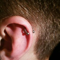 an ear piercing is seen in this image