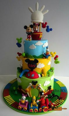 a mickey mouse birthday cake on a table