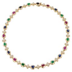 Admire the exquisite brilliance of the Multi-Color Yellow Gold Estate Necklace, featuring 8 Sapphires, 7 Rubies, 7 Emerald Cabochons, and 22 Diamonds totaling approximately 1.75 carat total weight. G/H in color and SI1/SI2 in clarity. Crafted from 14 karat yellow gold in the 1980's, this truly unique piece is sure to add a luxurious touch to any ensemble. This beautiful piece measures 16 inches in length. -Multi-Color Yellow Gold Estate Necklace -8 Sapphires, 7 Rubies & 7 Emerald Cabochons -22 Diamonds approx. 1.75ct TW G/H SI1/SI2 -14KT Yellow Gold -Circa 1980's Sapphire Diamond Necklace, Vintage Choker Necklace, Vintage Choker, G H, Sapphire Diamond, Yellow Color, Vintage Necklace, Unique Pieces, Diamond Necklace