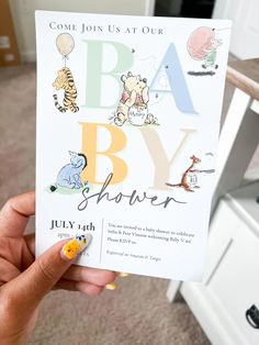 someone holding up a baby shower card with winnie the pooh and tigger on it