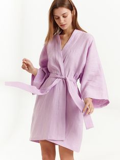 "ATHENA is a robe style wrap dress. DETAILS - Self tie belt with no closure or belt loops - Above the the knee length - Robe style - Dropped shoulders - Long sleeves - Side seam pockets - 100% midweight European linen fabric - Cut and sewn to order just for you in our studio COLOR - Lilac, you can also choose other colors above - Fabric samples are available here https://www.etsy.com/listing/586569696/linen-fabric-samples SIZING & FIT - Very oversized fit - Length is approximately 36 inches Style Wrap Dress, Linen Summer Dress, Kimono Wrap Dress, Linen Wrap Dress, Linen Kimono, Linen Robe, Apple Dress, Linen Tunic Dress, Navy Blue Midi Dress