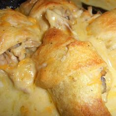 chicken and cheese casserole with melted cheese on top is ready to be eaten