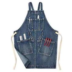 an apron that has scissors in it and some other items on the back of it