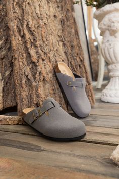 Exude casual-cool style in comfort in these slip-on-and-go clogs, crafted from a soft suede in a versatile neutral hue for effortless pairing. A durable TPU sole ensures tread-safe steps. Suede upper Man-made leather lining Man-made insole TPU sole Casual Clogs With Buckle Closure For Outdoor, Casual Mules With Buckle Closure For Outdoor, Casual Suede Mules For Outdoor, Casual Suede Clogs With Textured Footbed, Casual Closed Toe Clogs With Textured Footbed, Casual Slip-on Clogs With Buckle Closure, Casual Suede Mules With Cork-bed Midsoles, Gray Slip-on Clogs With Rubber Sole, Gray Slip-on Clogs With Cushioned Footbed