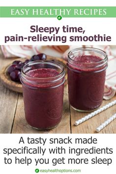 two mason jars filled with blueberry smoothie