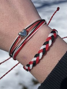 This bracelet stack duo is handmade by me from Brazilian waxed cord with an adjustable back. Bracelet can adjust from 6 inches to 9.5 inches in length.  Cincinnati Reds themed bracelet stack in red, black and white ⚾️❤️🖤🤍 Like the stack, but not the colors? This can be customized to any 3 colors of your choosing. Just let me know! Casual Red Braided Waxed Cord Bracelets, Red Heart-shaped Braided Bracelets For Gifts, Red Heart-shaped Braided Bracelets As Gift, Adjustable Red Heart Friendship Bracelets, Red Heart-shaped Braided Bracelet As Gift, Red Waxed Cord Friendship Bracelets, Handmade Red Braided Heart-shaped Bracelets, Handmade Red Braided Heart Bracelets, Adjustable Red Heart Bracelet For Friendship