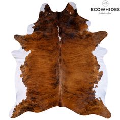 a brown and white cowhide rug on a white background