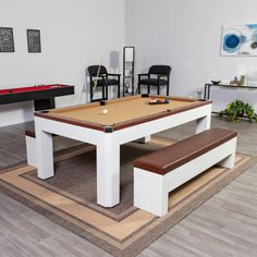 a pool table and two chairs in a room