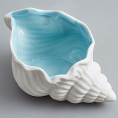 a blue and white bowl sitting on top of a table