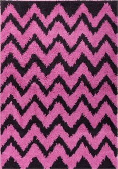 a pink rug with black and white chevrons