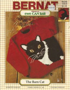 a red sweater with a black and white cat on it