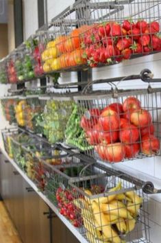 fruit and vegetables are arranged in baskets on the wall