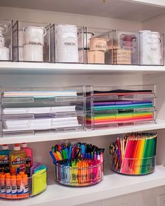 the shelves are filled with different colored pencils and markers