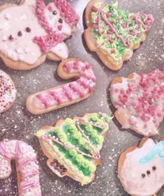 decorated cookies are arranged in the shape of animals